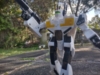 The VF-1S in battroid mode, posed as if it is taking a step