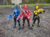 Action figures of the Lupinrangers from Kaitou Sentai Lupinranger VS Keitsatsu Sentai Patranger. Three color-coded characters: Lupin Red, Lupin Blue, and Lupin Yellow. Their masks are shaped like top hats. Lupin Blue and Lupin Yellow are wielding firearms (the VS Changer), Lupin Red is wielding a VS Changer and a sword (the Lupin Sword). The pants of their costumes are all black, with Lupin Yellow having a skirt.