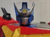 AOTP Star Convoy in robot mode, close up shot of his robot mode head to show off the details. As said previously, it is very much a more anime-styled G1 Optimus Prime head with larger side antenna and an additional silver crest with a yellow detail in the center of it.