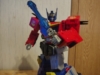 AOTP Star Convoy in robot mode, wielding his sword. Which has a blue blade that is OBVIOUSLY not just a blast effect (it is one)