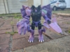 Beast Wars Megatron in robot mode, standing. One of his arms is his T. Rex head