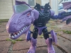 Beast Wars Megatron in robot mode, posed, with his T. Rex head arm lunging towards the camera