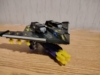 Beast Wars II BB in plane mode, a stealth bomber with missiles attached to the underside of the wings and a gatling gun with missiles attached underneath