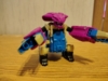 Legacy Cancer in beast mode, a robotic crab-like monster that is predomantly purple and blue with some tan and black