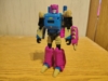 Legacy Cancer in robot mode. Believe it or not, he's the same colors as his beast mode - purple, blue, with some tan and black. He also has a purple shield with tan spikes on his arm