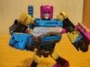 Legacy Cancer in robot mode, posed and wielding his gun - Browning, who true to his name is literally modelled after a Browning model 1910