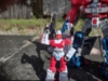 Legacy Minerva in robot mode, holding up her gun with Legends Super Ginrai behind her and partially off-camera