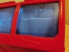 Legacy RID Optimus Prime in firetruck mode, close up shot of his front windows showing the sculpted seats visible on the inside