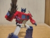 Another robot mode image of Studio Series 86 Optimus Prime holding his ion blaster but posted in a more action stance