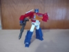 Studio Series 86 Optimus Prime in robot mode wielding both his ion blaster and Energon axe