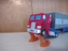 Studio Series 86 Optimus Prime in vehicle mode launching up using the effects parts to recreate that scene from The Transformers: The Movie